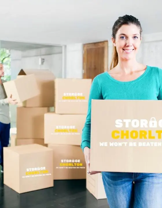 Customer carrying a Storage Chorlton box into storage